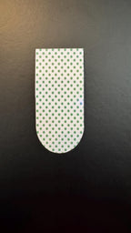 Holographic polka dot magnetic bookmarks with colorful dots and shiny finish, ideal for marking pages in books.