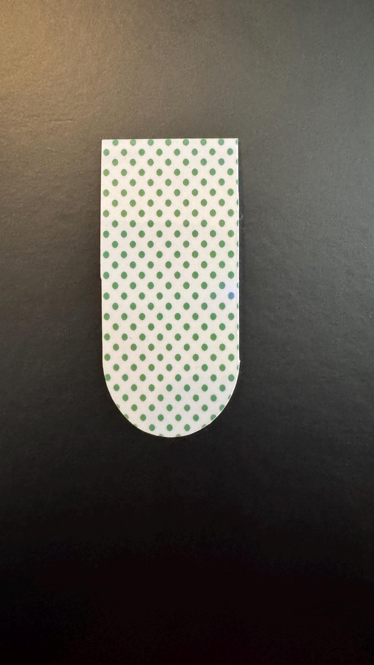Holographic polka dot magnetic bookmarks with colorful dots and shiny finish, ideal for marking pages in books.
