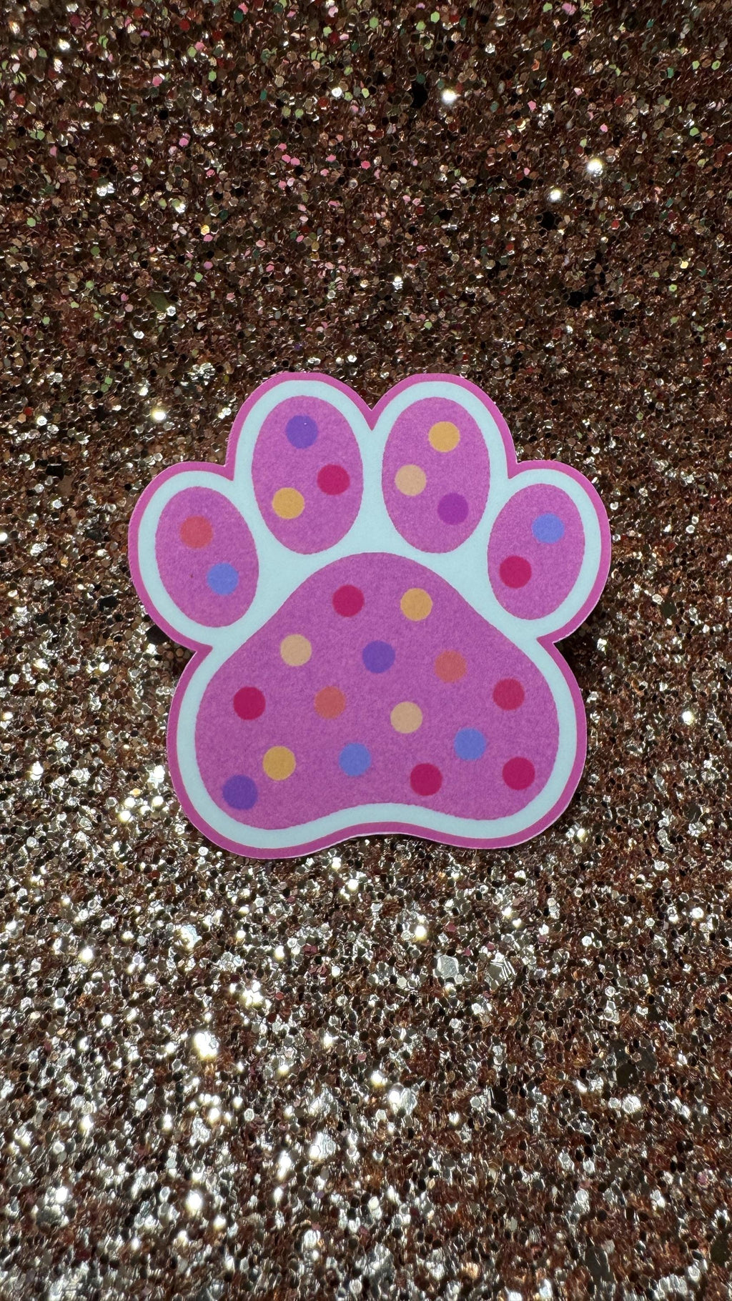 Colorful polka dot paw print sticker featuring cute animal design, waterproof and durable vinyl pet lover gift.
