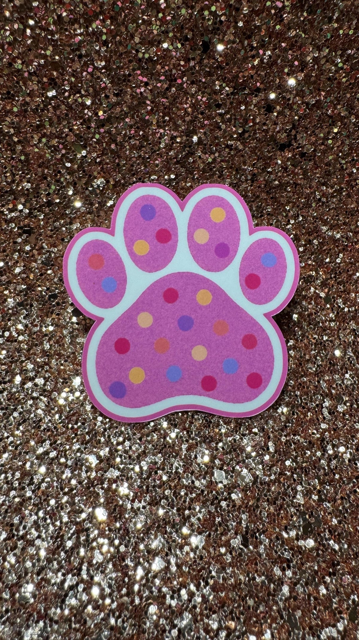 Colorful polka dot paw print sticker featuring cute animal design, waterproof and durable vinyl pet lover gift.