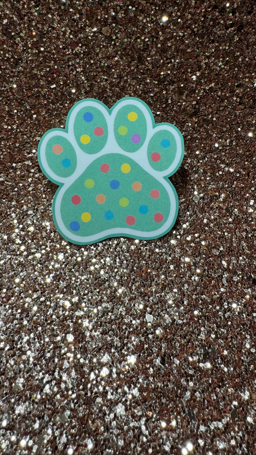 Colorful polka dot paw print sticker featuring a cute animal design, waterproof and durable vinyl, perfect for pet lovers.