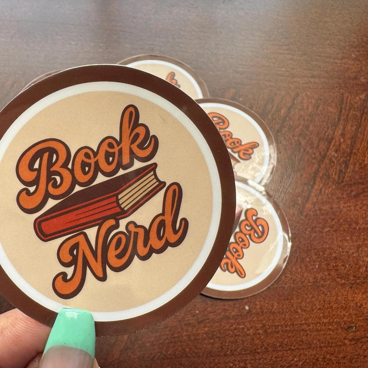 Cute Book Nerd vinyl sticker by Forcebuilder, featuring a book lover design for laptops, journals, water bottles, and more.