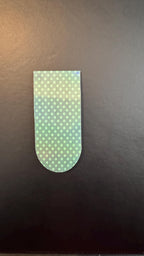 Holographic polka dot magnetic bookmarks with colorful shiny design, perfect for marking pages in books.