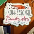 Cute bookworm vinyl sticker by Forcebuilder featuring a book lover design, perfect for journals and adding cozy, bookish vibes.