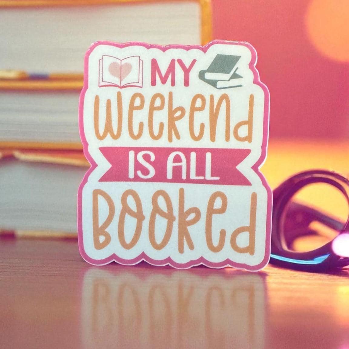 Cute vinyl sticker featuring "My Weekend Is All Booked" text, perfect for books, journals, and cozy reading accessories.