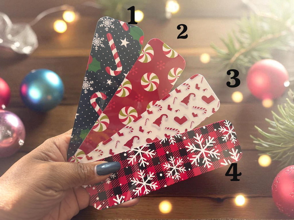 Set of four holiday-themed candy bookmarks from Forcebuilder, festive reading accessories with colorful, decorative designs.