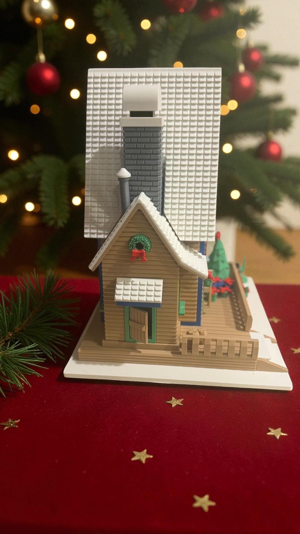 Custom personalized family Christmas cottage with LED lights, cozy winter decor, four color options, by Forcebuilder.